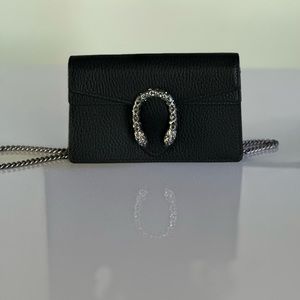 Black Gucci SUPREME SUPER MINI BAG. used twice.